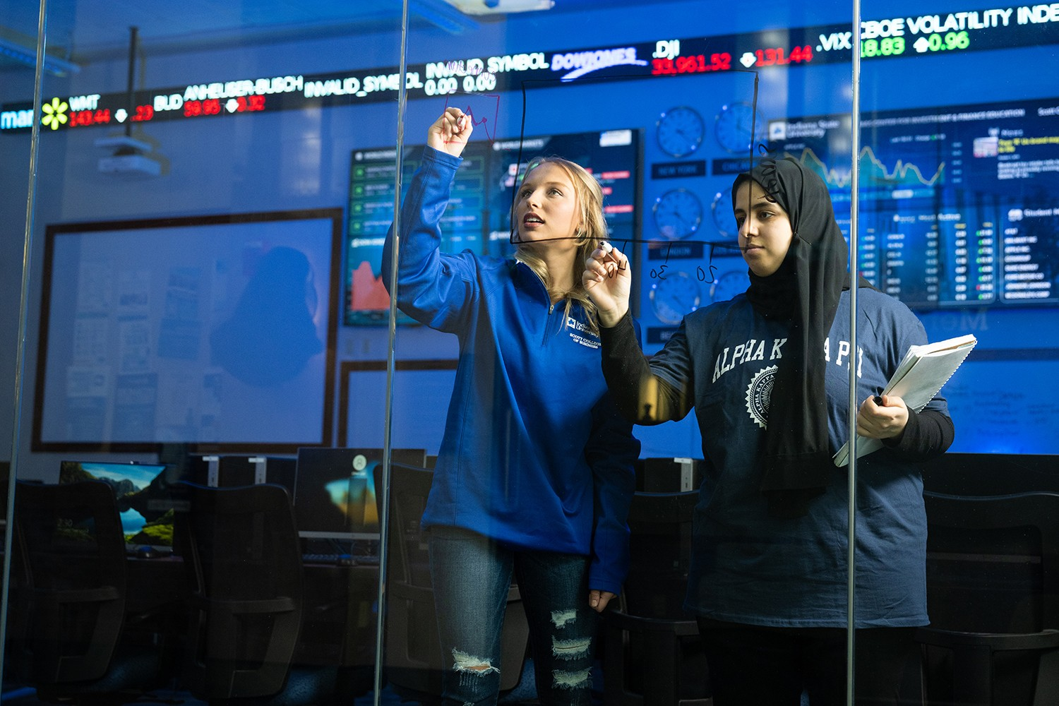 Two Business Students Working in a Classroom