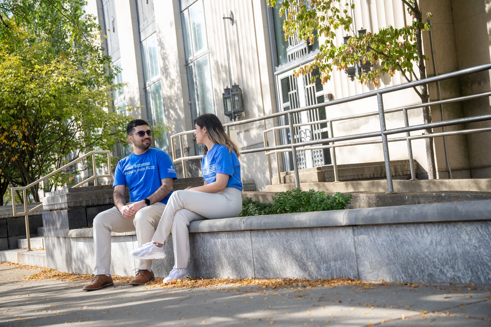 two people sitting on bench