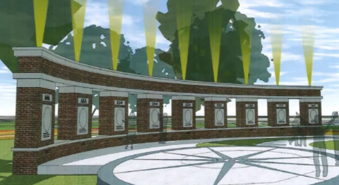 Rendering of a curved brick memorial plaza with engraved panels, a circular patterned walkway, and trees in the background.